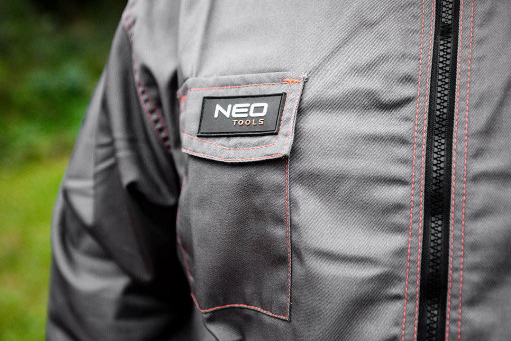 NEO TOOLS Munkavédelmi kabát, BASIC, XL/56, 35% pamut, 65% polyester, Többfunkciós zsebek, gumírozott derék, CE EN341 81-410-XL